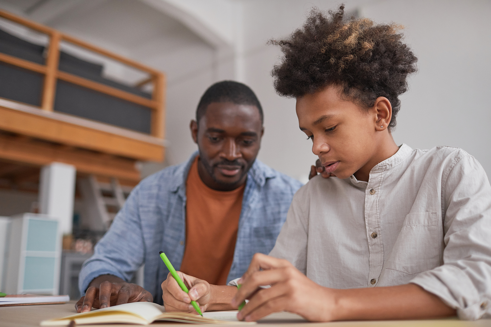 Portrait Of Teenage African-american Boy Doing Homework Or Study